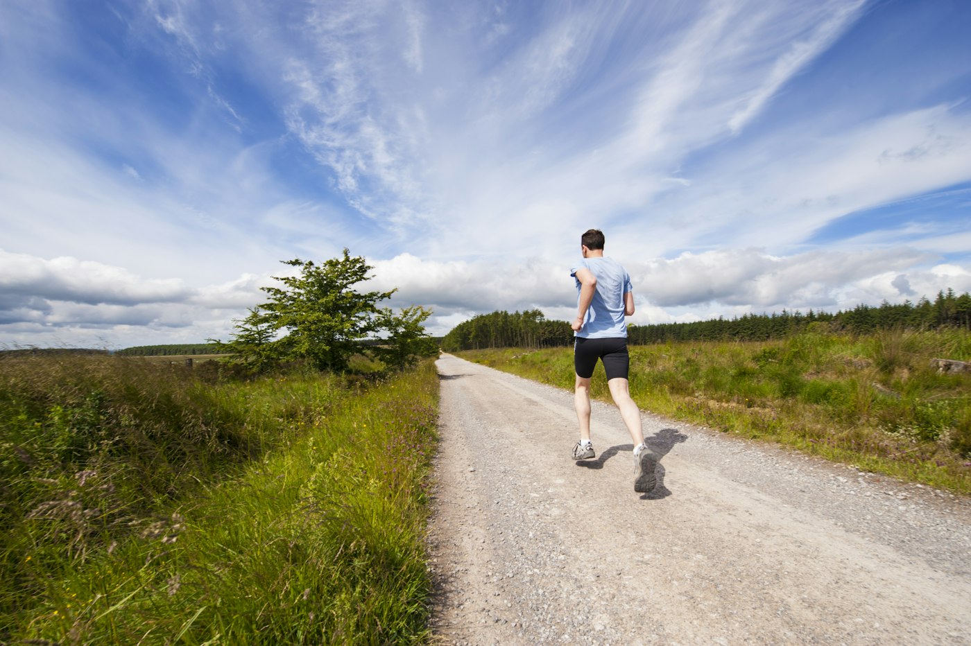 A runner moving along an open road